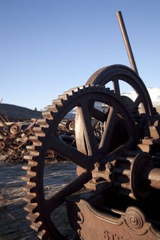 Old rustic farm equipment -- metal mechanical industrial worn wheel