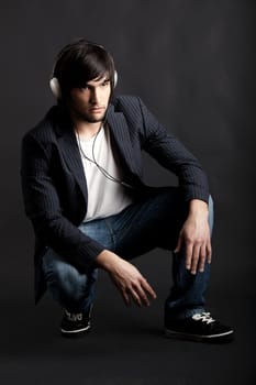 Young Man listening to music with headphones