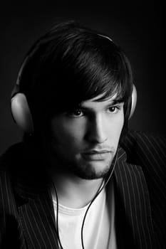 Young Man listening to music with headphones