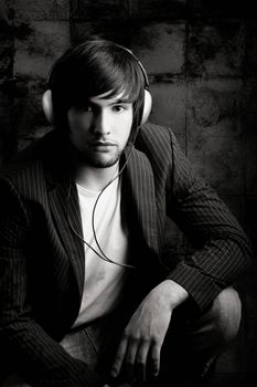 Young Man listening to music with headphones
