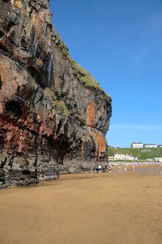ballybunion beach crowded with people by the cliffs