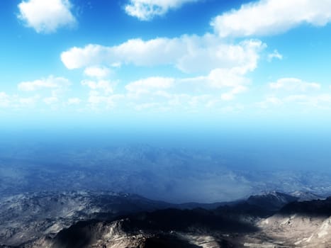 An aerial of a mountain landscape against a sky background. 