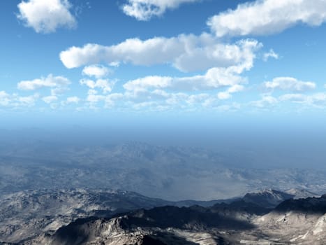 An aerial of a mountain landscape against a sky background. 