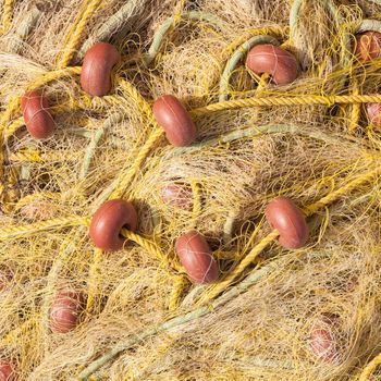 Pile yellow fishing net background texture pattern.