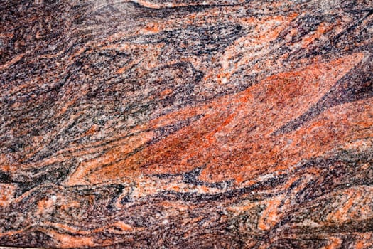 Beautiful texture of red-colored natural granite.