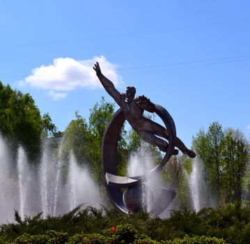 very beautiful fountain with a sculpture astronaut