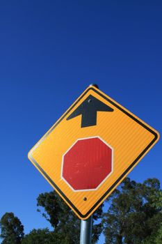 Stop ahead road sign close up.