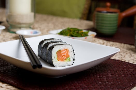 Fresh japanese salmon sushi served on a white plate