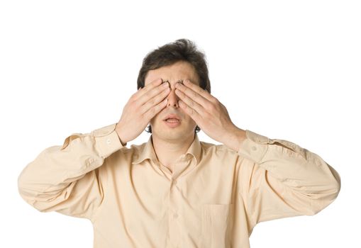 A man covering his eyes with his hands