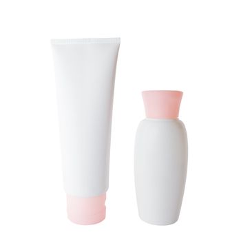 White plastic cream tube and bottle isolated over white