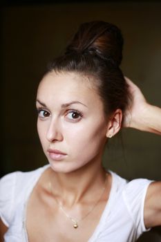 Portrait of the beautiful girl in studio