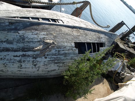 An old boat next to the harbour in Portland Maine