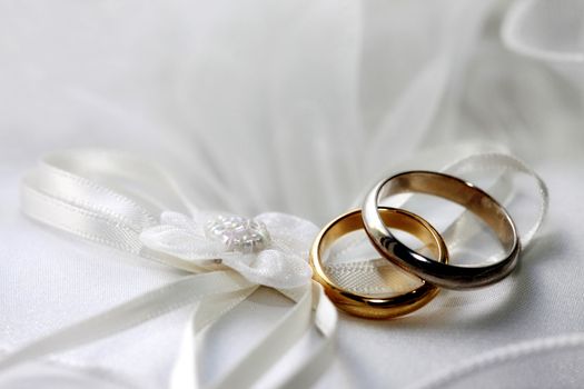 Wedding rings on a satiny fabric