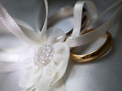 Wedding rings on a satiny fabric