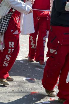 The parade is popular amongst the Russ - students in their last year of upper secondary school that celebrate the end of 13 years of school. This is their costumes during celebration, and their business cards and party effects lay on the streets. 