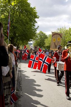 Norway's Constitution Day is parades and marching bands! Here is a marching band waving big national flags. 