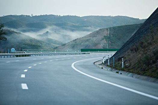 Turn of automobile highway in mountains of Portugal
