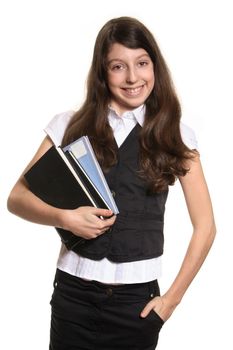The schoolgirl holds books and looks in a camera