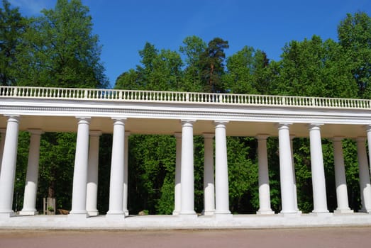 White colonnade in a park, horizontal version