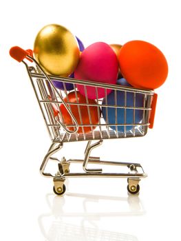 Many multi-coloured Easter eggs in the small store cart
