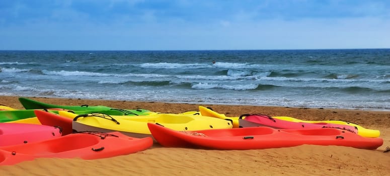 Colorful canoes on a beach