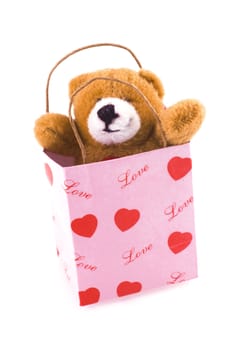 Cute little plush bear in pink 'love'bag.