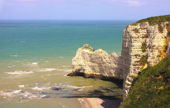 Beach with cliff Falaise d'Aval. Normandy, Cote d'Albatre, France. 