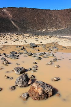 Small puddle at the bottom of Amboy Crater in the deserts of southern California.