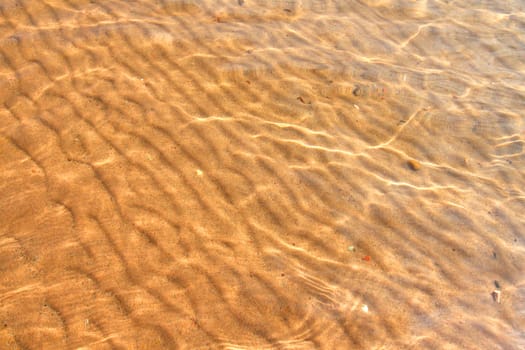 Interesting patterns in the sand seen through crystal clear Wisconsin waters.