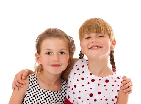 Two happy little sisters portrait isolated on white