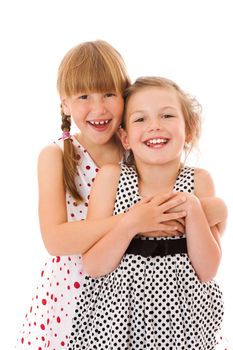 Two happy little sisters portrait isolated on white