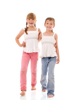 Two happy little sisters portrait isolated on white