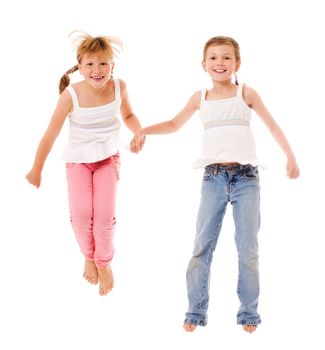 Two happy little sisters portrait isolated on white