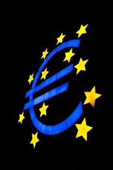 Euro symbol isolated on black with blue color and yellow stars