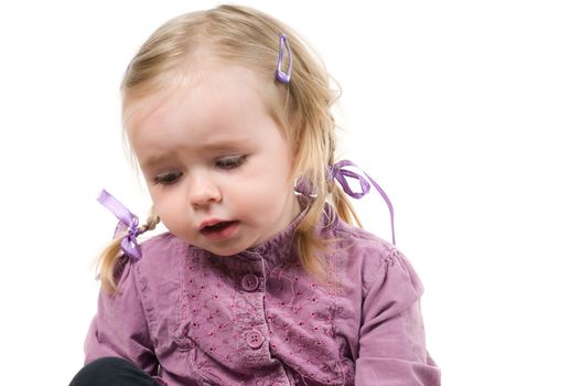 A little cute girl sitting in studio