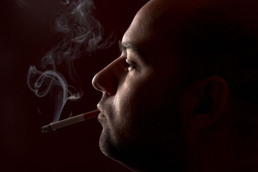 close up of an smoking man