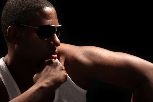 Young african american male on black background