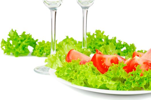 Leaves lettuce on plate on white background isolated