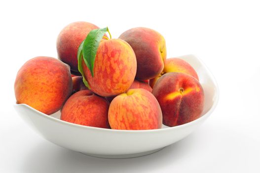 Bowl of fresh picked ripe peaches.