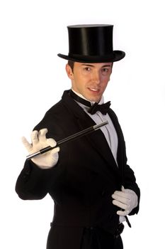 young magician performing with wand on white background