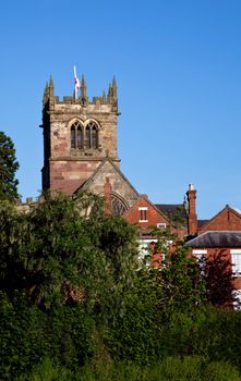English church over the roofs of an old town in Shropshire