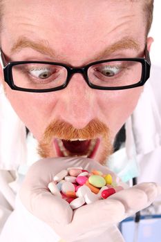 doctor taking hand full of tablets on white background