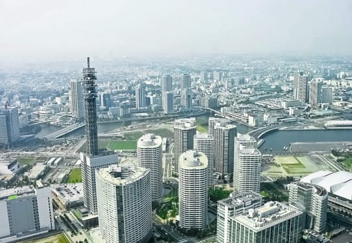 Tokyo overview with white skyscraper in daytime