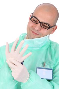 Details surgeon putting medical gloves on