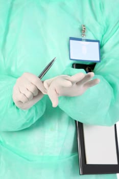 Details surgeon putting medical gloves on