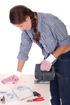 woman carpenter at work on white background 