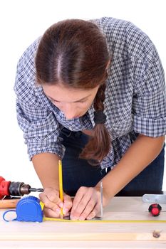 woman carpenter at work on white background 