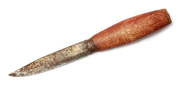 Rusty old knife with red wooden handle