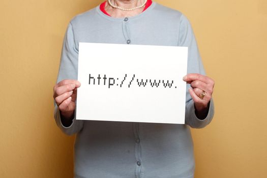 A senior woman holding an Internet sign