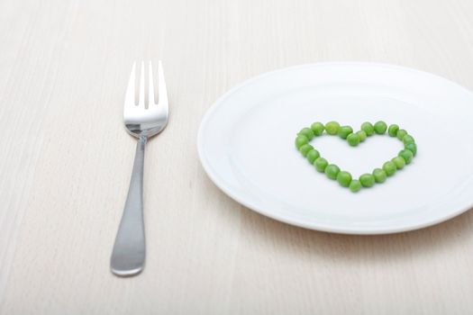 Heartshaped peas on a plate